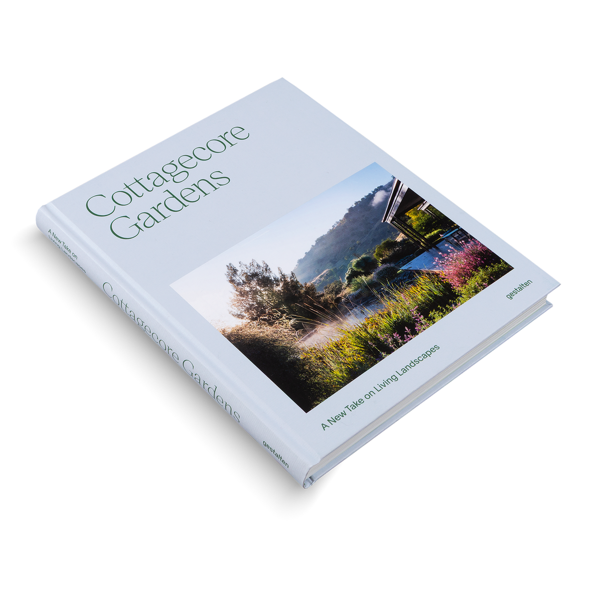 Book titled 'Cottagecore Gardens' with a cover featuring a garden scene on a light blue background.