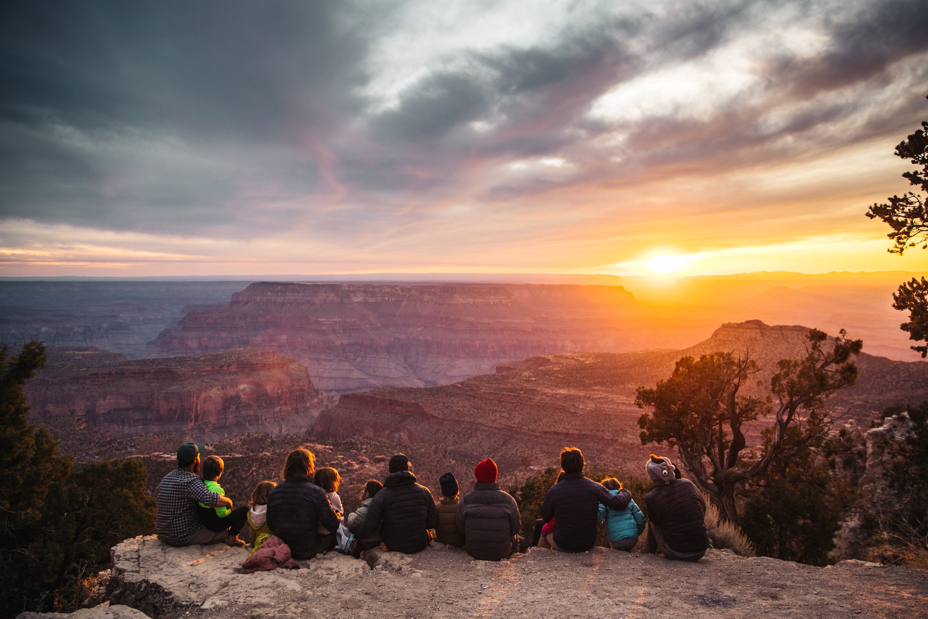A family looking at the sunset in Family Adventures by gestalten