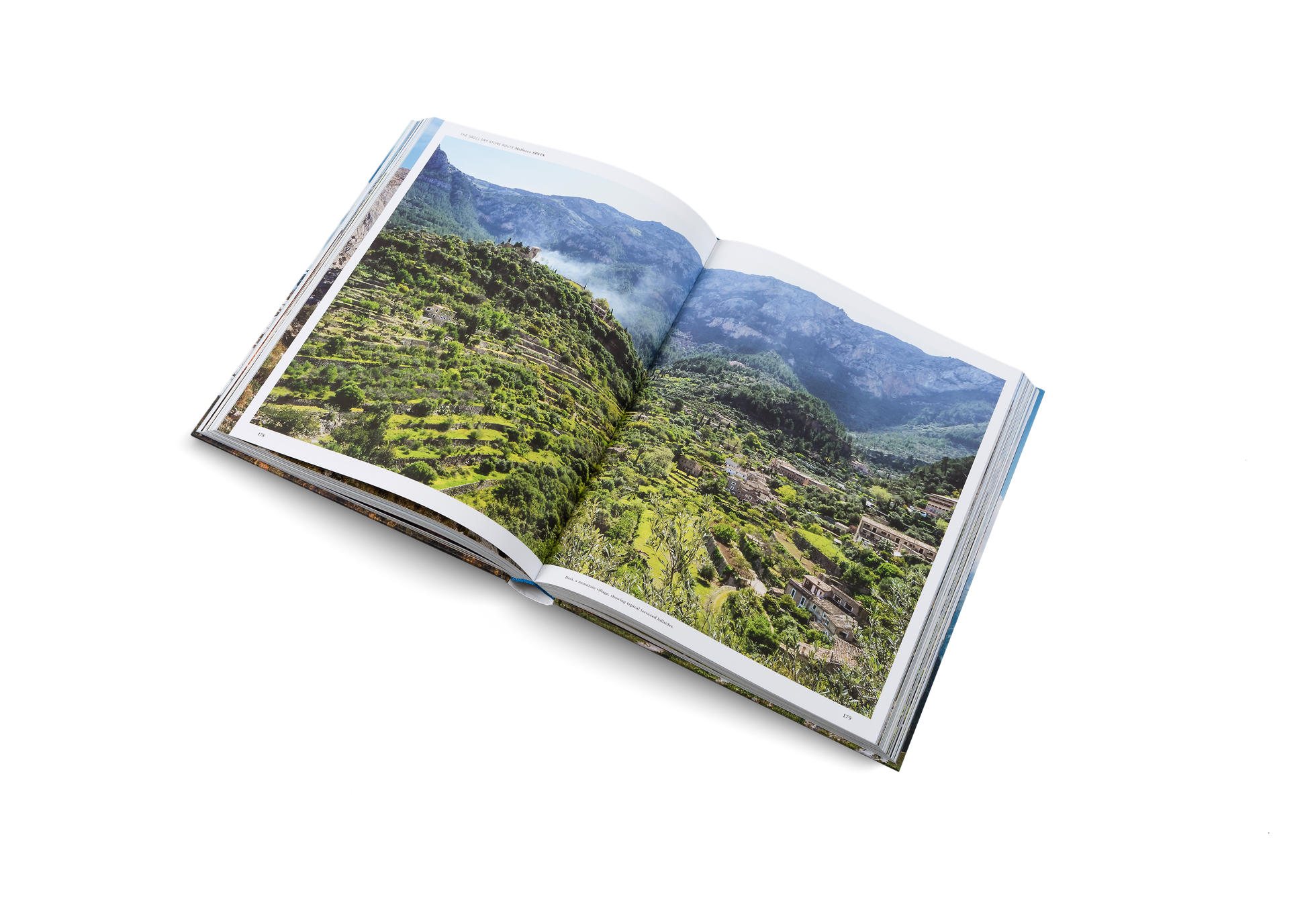 Deià, a mountain village, showing typical terraced hillsides is on the way of the GR221. Wanderlust Europe shows you the way through the dry stone route.