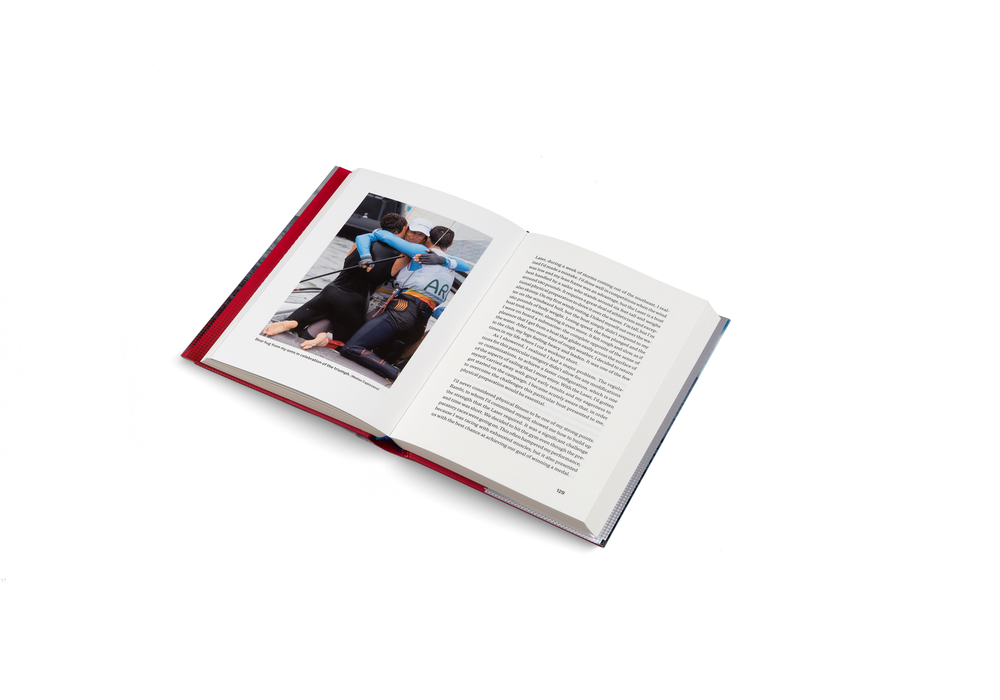 Santiago Lange hugs his sons in celebration of his sailing triumph.