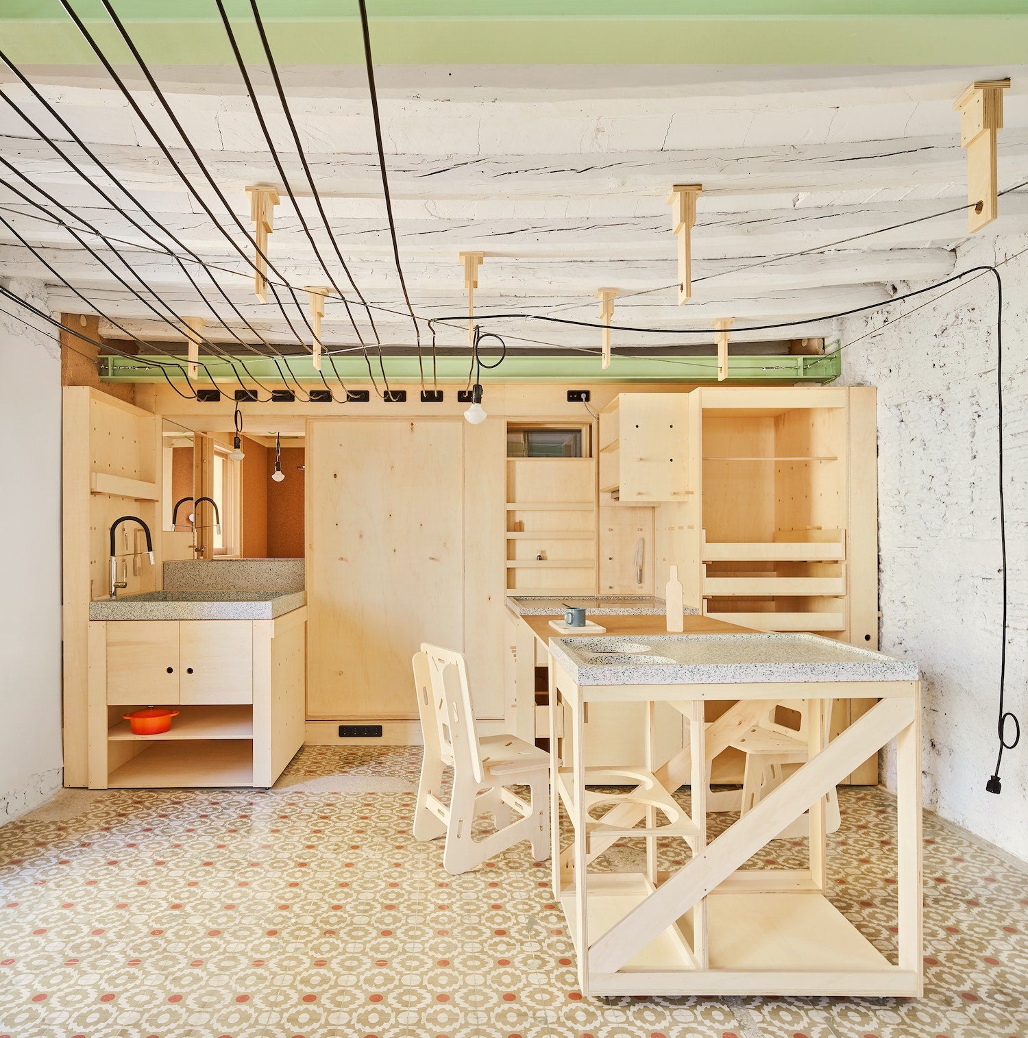 „The Tiniest House is for those who dream about building a house and believe they can’t afford it,” says Spanish architecture practice Aixopluc, which wanted to find a working solution to the problem of making old or derelict buildings inhabitable without a huge renovation budget.