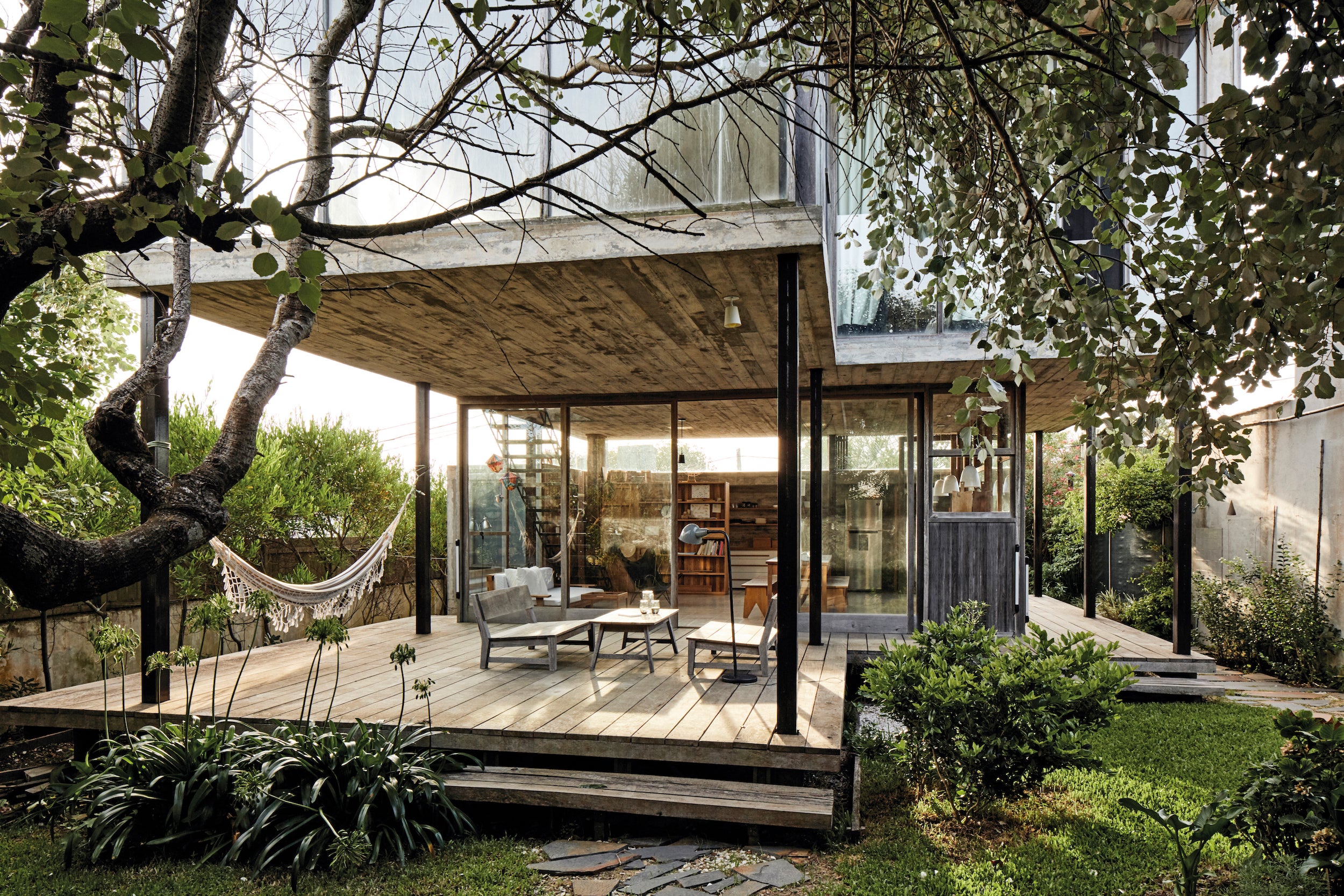 The home’s cement and steel structure allows the outdoor deck to be sheltered from the elements in La Pedrera House.