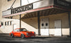 Red air-cooled Porsche model standing in front of former Pfanni factory in Munich. (Photo: Race Service)