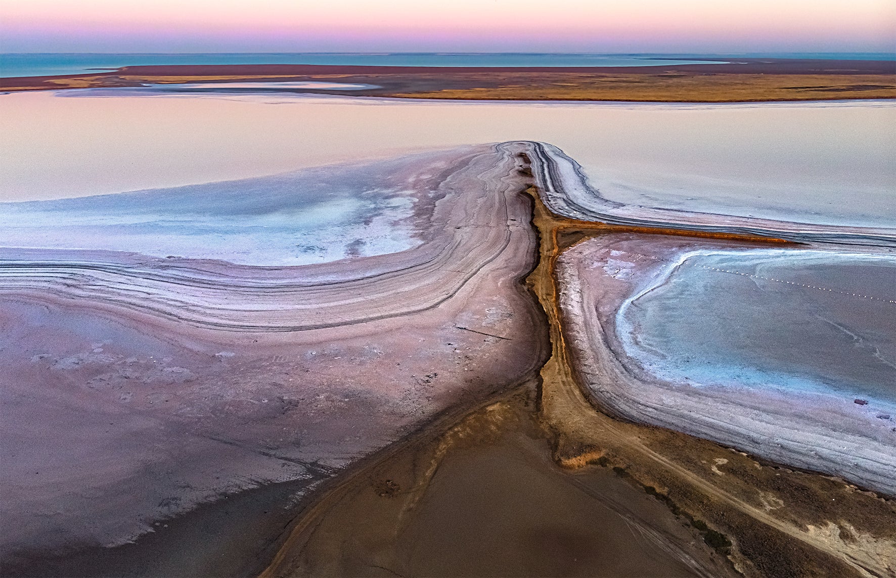 Aerial view of a salt lake with colorful patterns