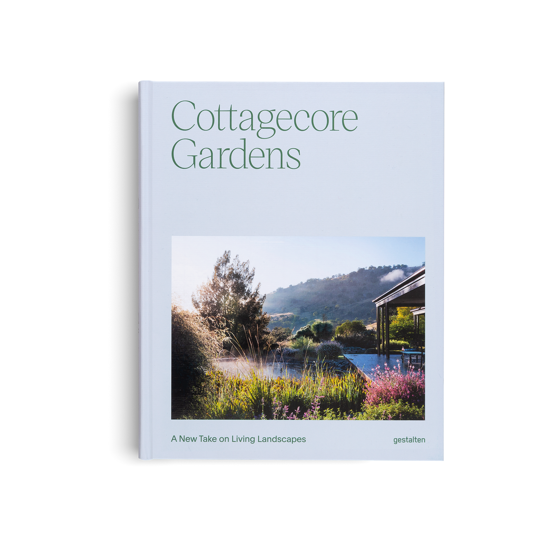 Book titled 'Cottagecore Gardens' with a cover photo of a garden and house on a light blue background.