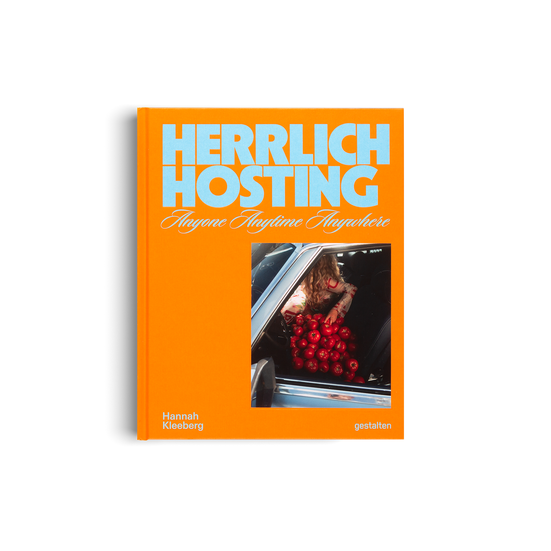Book titled 'Herrlich Hosting' with an orange cover and a photo of a person loading apples into a car.