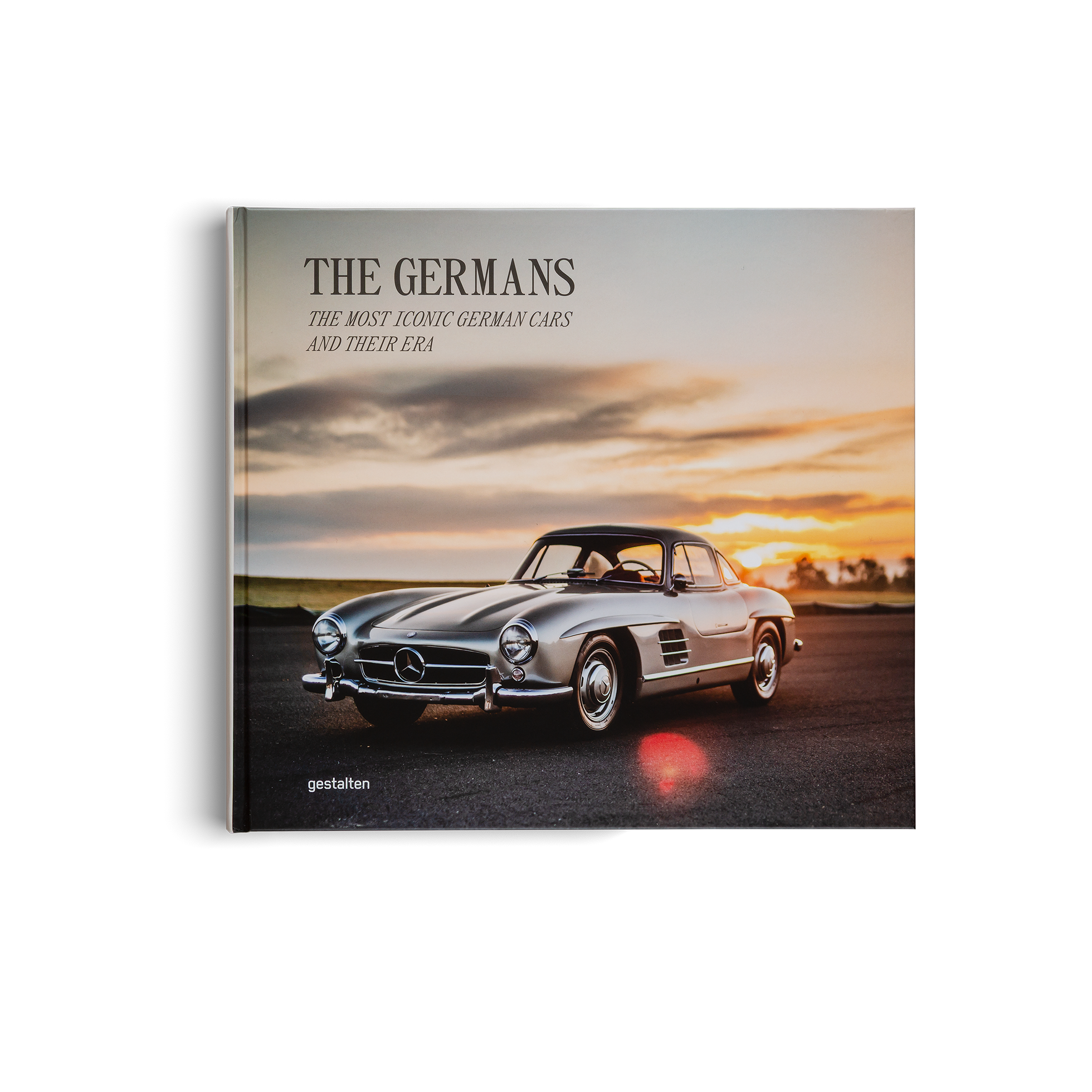 Book cover featuring a classic Mercedes-Benz car with a sunset background