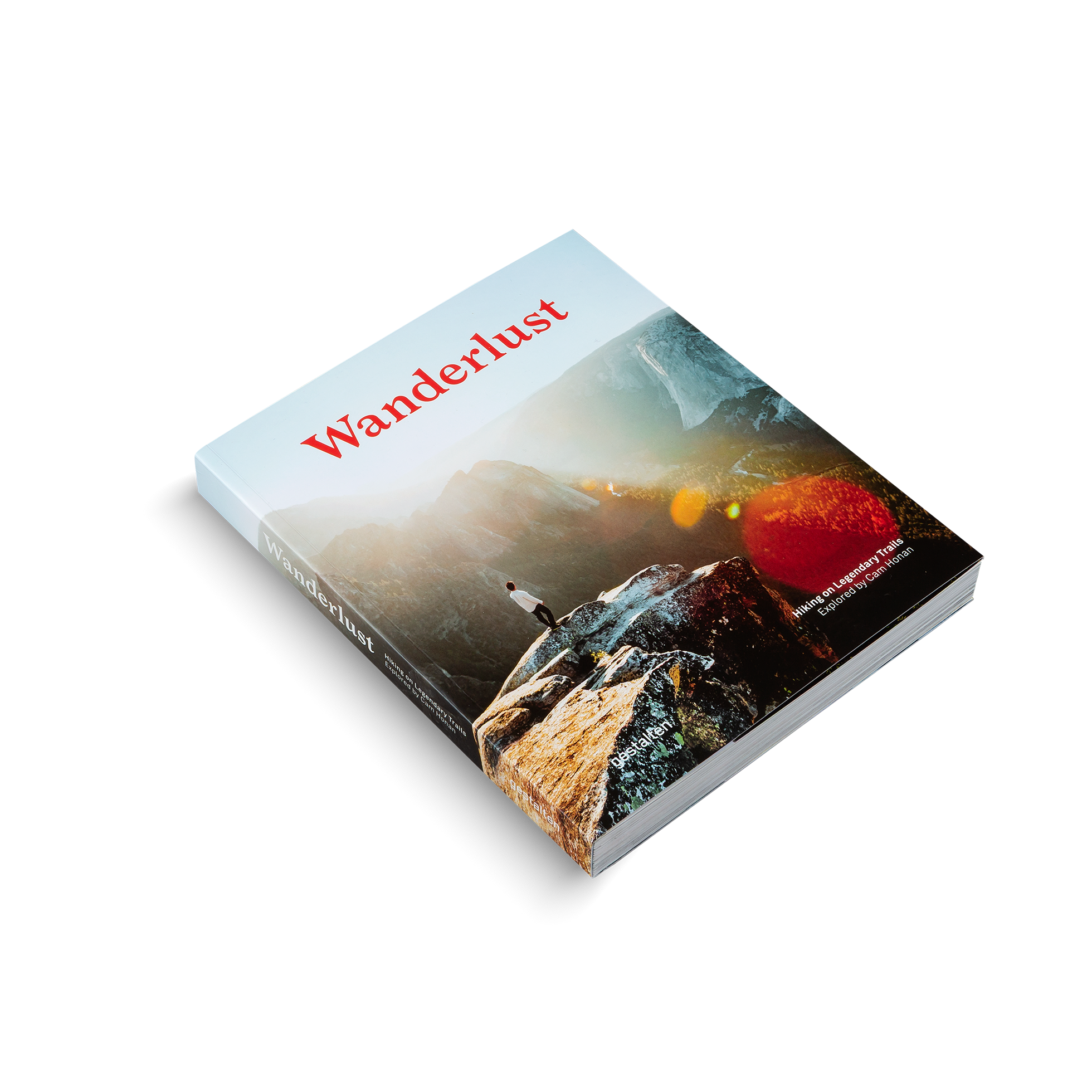 Book titled 'Wanderlust' with a mountain landscape on the cover