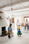 This happy family lives in a minimalist rustic refuge nestled in the mountains in Corsica.