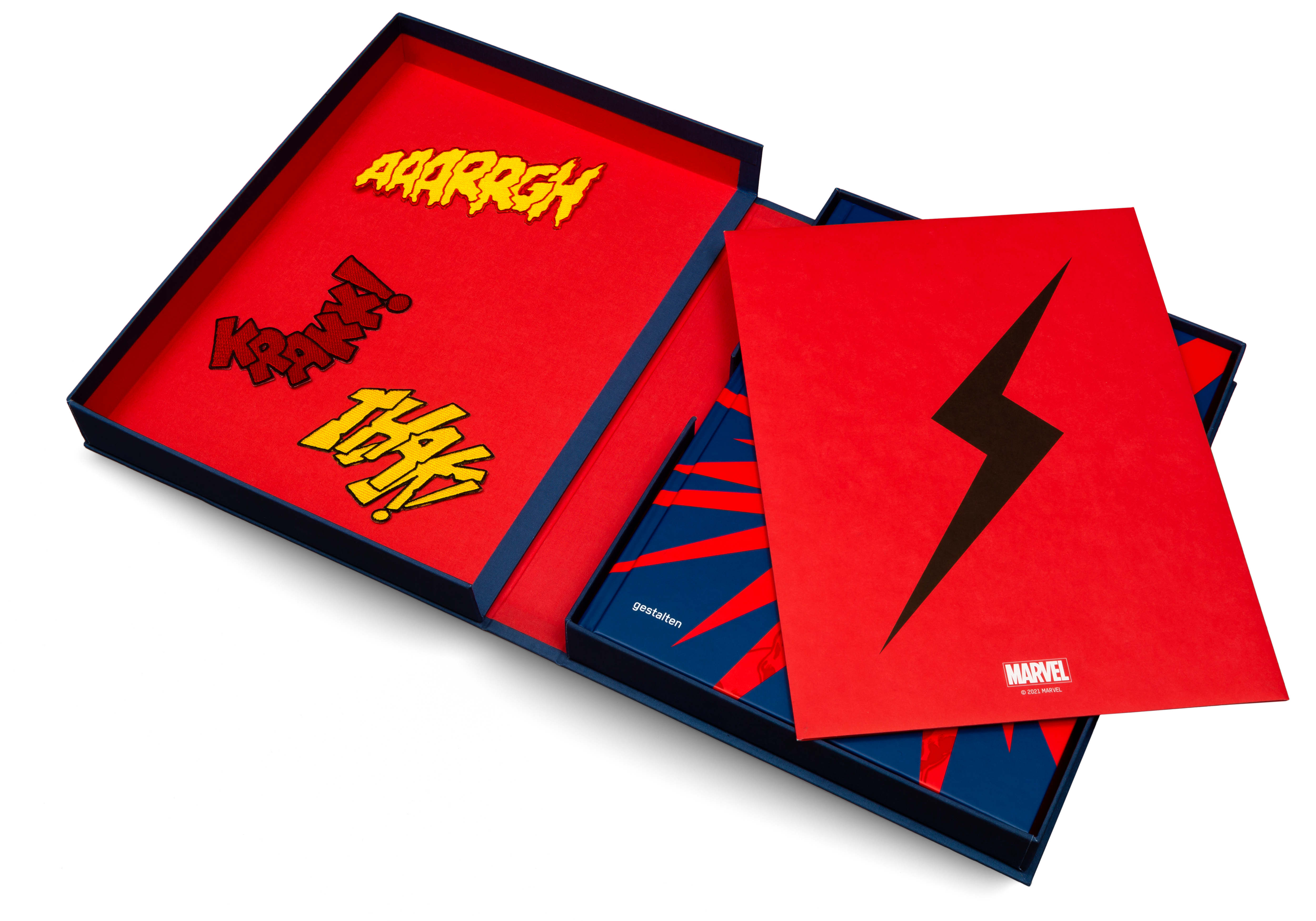 The linen bound presentation box contains three patches, three screenprints and a special edition of Marvel By Design