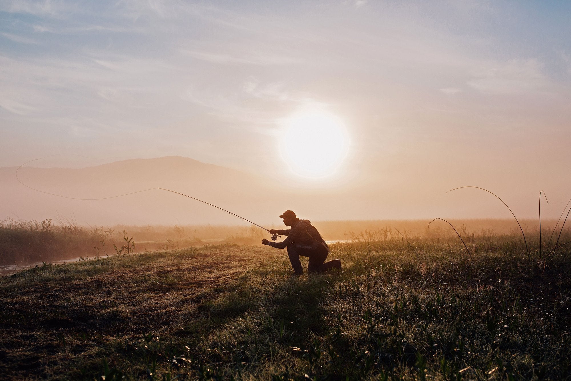A fly fisher in the morning