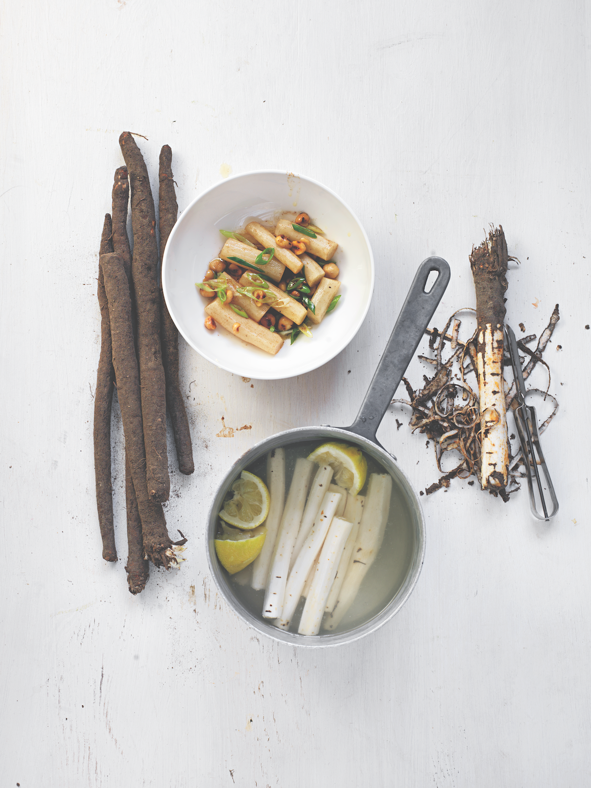 Black salsify with butter, hazelnuts and scallion