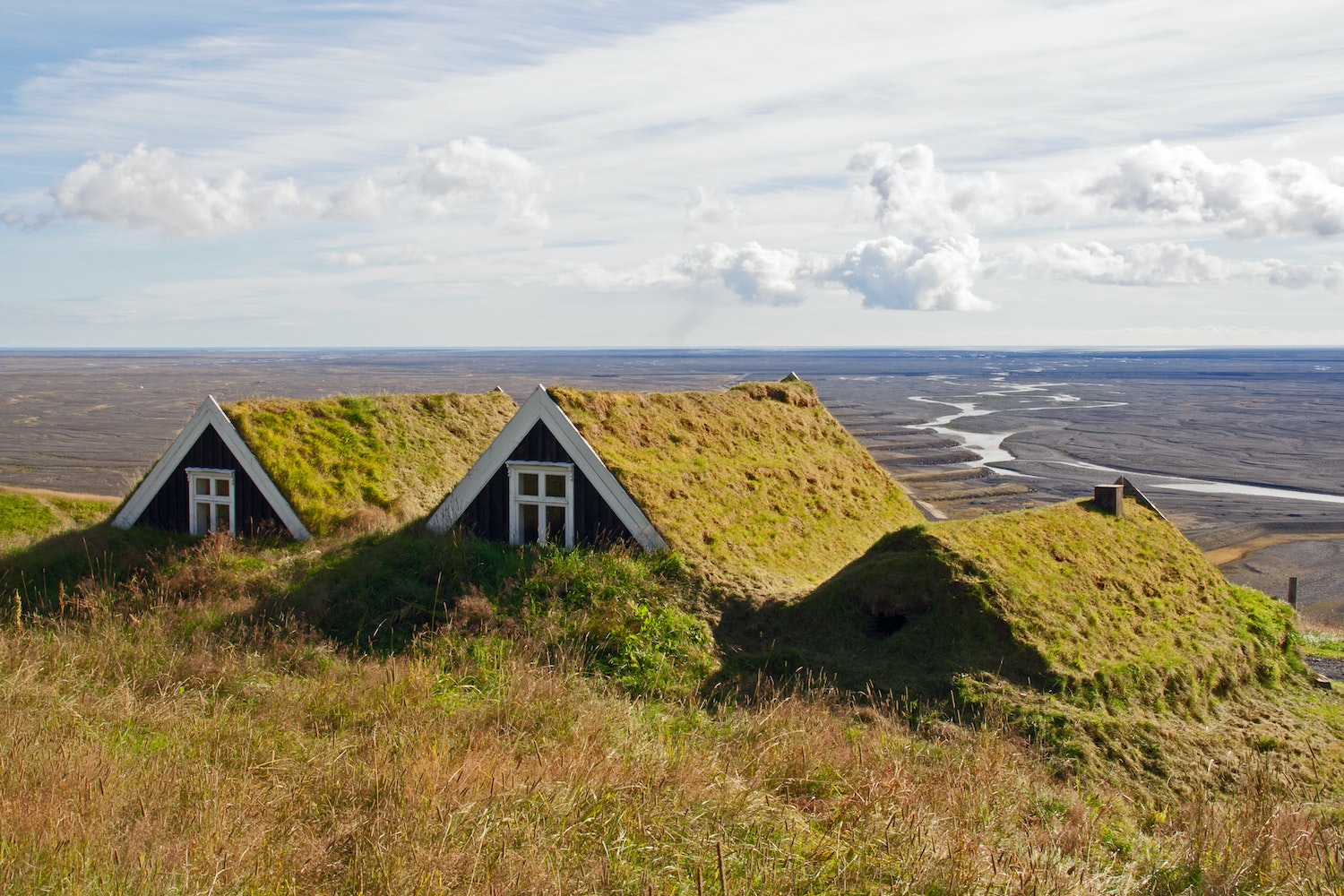 Turf-roofed farmhouses at Sel, located near the entrance of Skaftafell Nature Reserve. This image is published in Wanderlust Nordics by Cam Honan and gestalten.